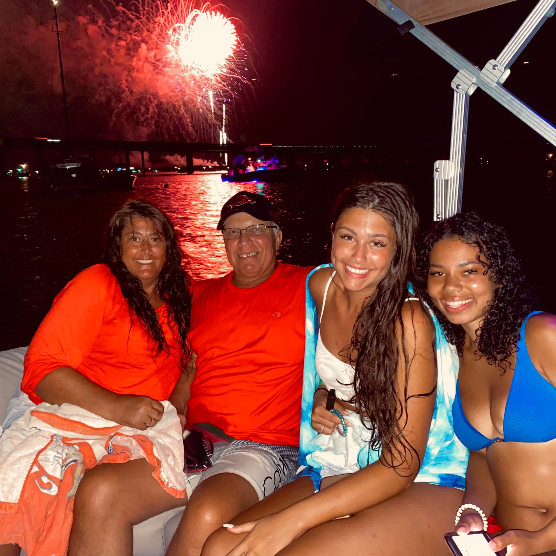 family enjoying fireworks cruise at Crab Island