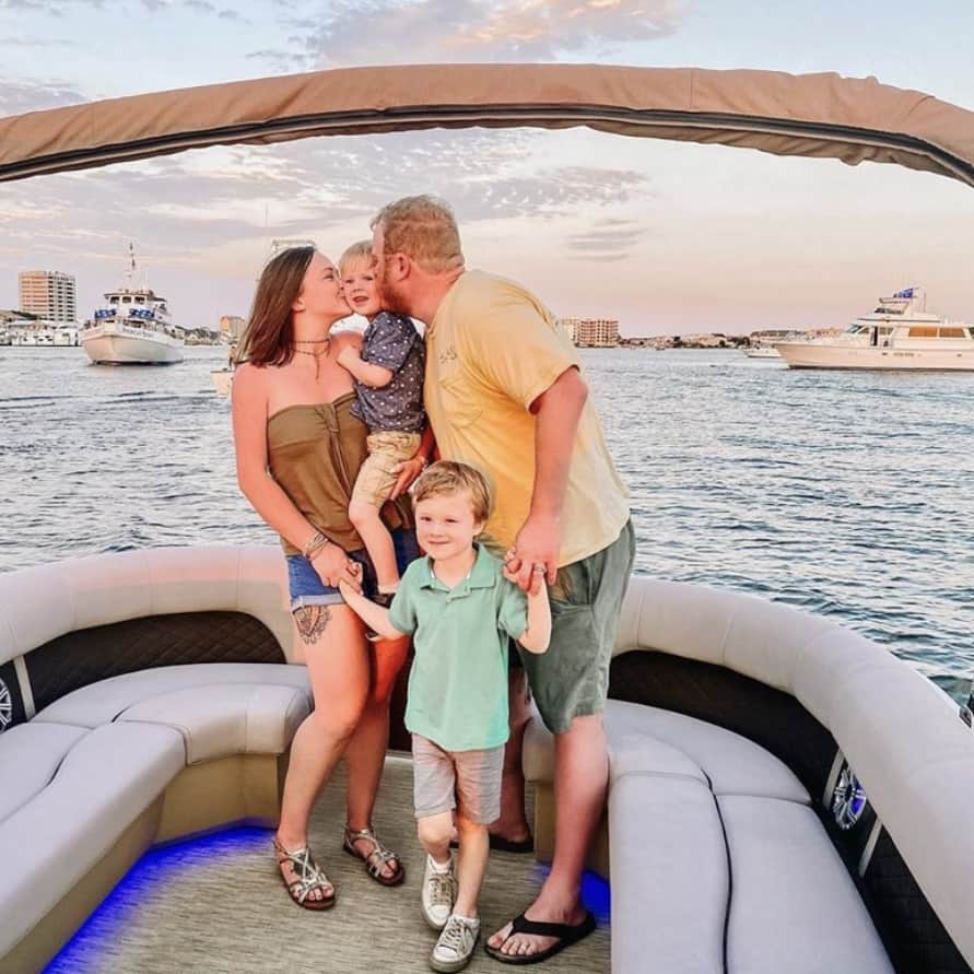 Family taking a picture on a private sunset cruise